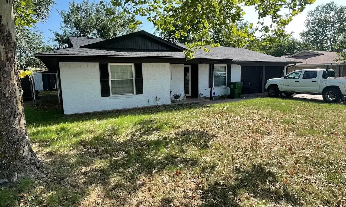 Professional roofing crew working on a residential roof in Tabernacle